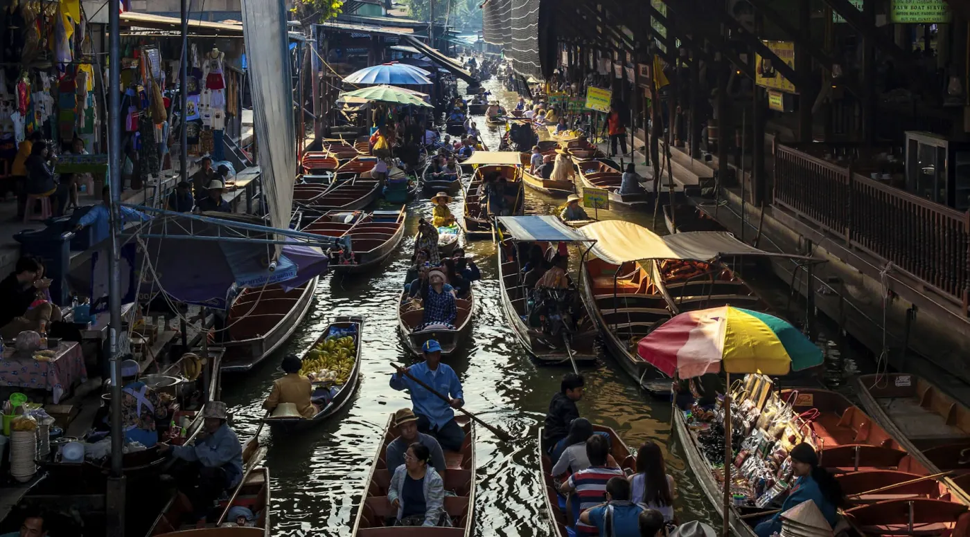 Floating market vendor boats in morning light, Thailand